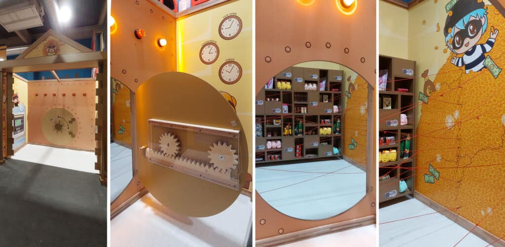 Décor d'une salle de coffre fort comprenant des mécanismes fabriquée en bois et peint en doré pour un escape game pour enfants